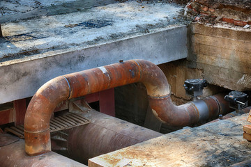 Central heating supply line under reconstruction in the summer city street
