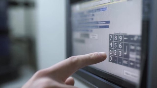 the service engineer changes and presses on the touch panel