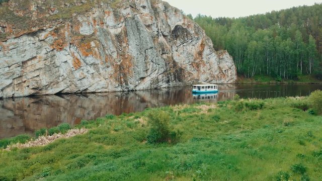 drone shot river boat sails on the mountain river. River tram. water tourism