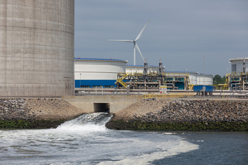 Waste water discharge near oil storage tanks in Dutch harbor Rotterdam, biggest seaport of Europe