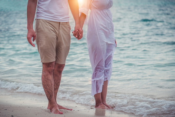 Couple Happy honeymoon romantic in love at beach sunset. in love on the beach. © A Stockphoto
