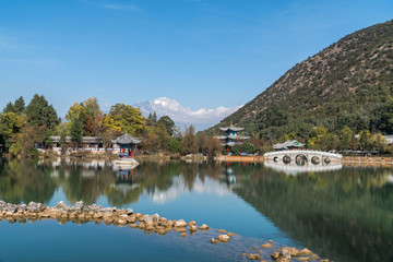 Fototapeta na wymiar Lijiang old town,China. scene-Black Dragon Pool Park. . In the there, you can see Jade Dragon Snow Mountain.