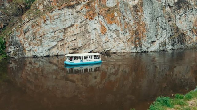 drone shot river boat sails on the mountain river. River tram. water tourism