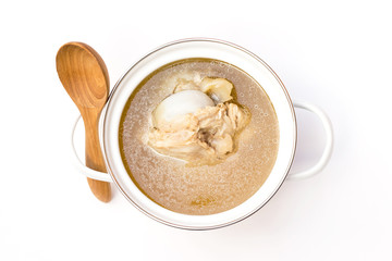 Pot of pork bone soup isolated on white background.