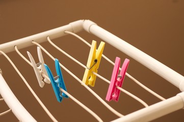 Isolated colored clothespins on the clotheshorse (Pesaro, Italy, Europe)
