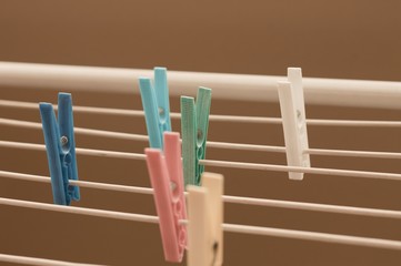 Isolated colored clothespins on the clotheshorse (Pesaro, Italy, Europe)