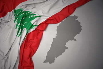 waving colorful national flag and map of lebanon.