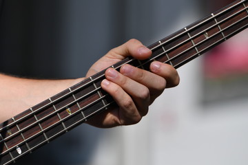 The hand of a guitar player. A street musician in Berlin-Germany.