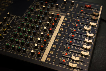 Multi channel music mixer in music studios, or radio stations.