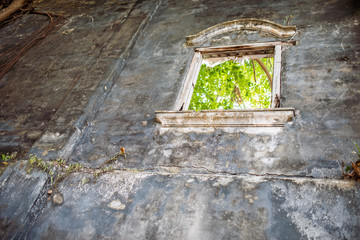 Window in a grungy looking wall