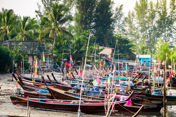 Fototapeta na wymiar Traditional Wooden Fishing Boats Docking At the beach