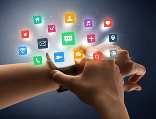 Naked female hand with smartwatch and  application labels around and dark background