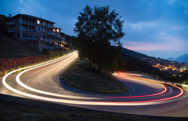 light painting in mountains road cars fast alps view