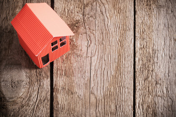 paper house on old wooden background