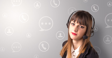 Young female telemarketer with white speech bubbles around her