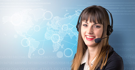 Young female telemarketer with blue background and world map and numbers behind her