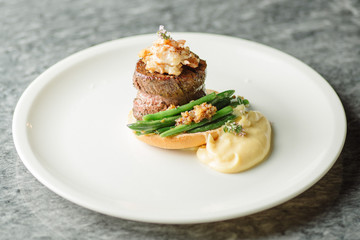 meat with asparagus and shrimps on bread