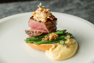 meat with asparagus and shrimps on bread