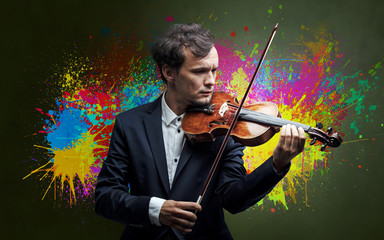 Young classical violinist musician with colorful splotch wallpaper

