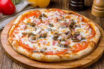 Pizza with ham and mushrooms