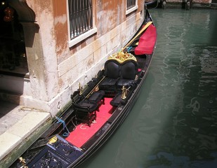 Venetian gondola/ Venetian gondola moored to the building - 214370854