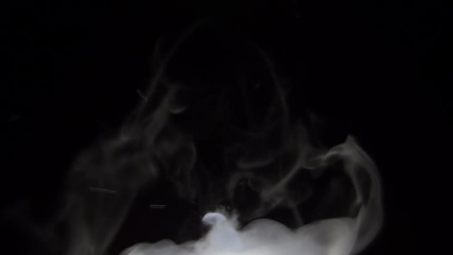 BUBBLING MIST WITH NEGATIVE SPACE ABOVE.  SLOW MOTION.
