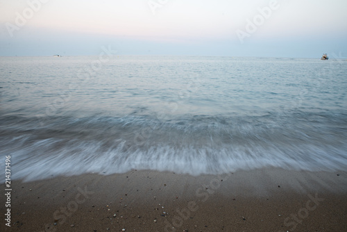 Long Exposure Beach In Barcelona Spain With Clear Blue Waves