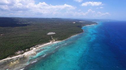 Aerial view of Turquoise waters, beach and the reef in Jamaica