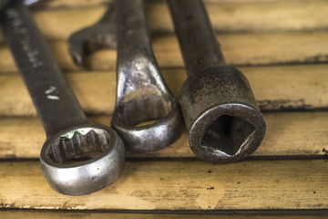 Old wrenches on a bamboo table
