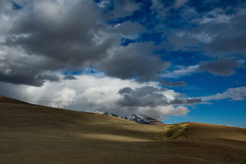 Western Mongolia. The endless steppe is surrounded by mountain ranges.
