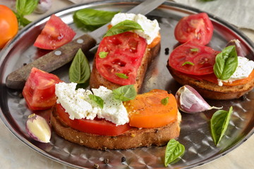 Вruschetta with tomatoes, basil and cheese feta