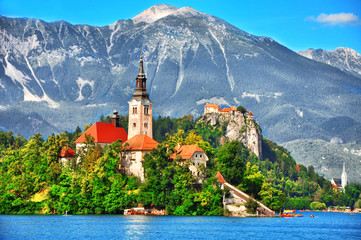  Bled lake,island with Pilgrimage Church of the Assumption of Maria and the famous old castle on...