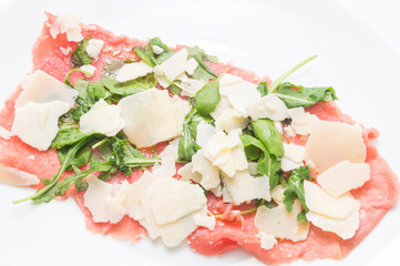 Beef carpaccio with parmesan, rocket and balsamic vinegar