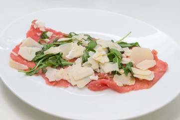 Beef carpaccio with parmesan, rocket and balsamic vinegar