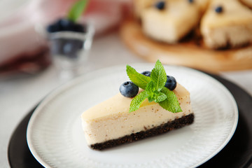 Classic New York cheesecake with fresh berries on white plate