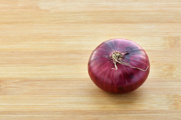 Red onion on the table.