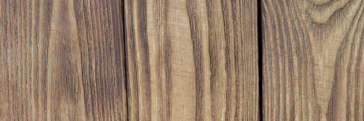 Colored background of light wooden boards arranged vertically.