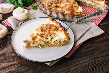 Kish with Chicken and Champignons on a Wooden Table