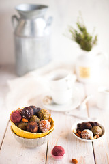 Assorted raw vegan sweet candy gluten-free balls with carob,  coconut and poppy seeds almonds nuts
