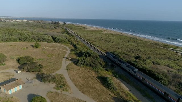 Drone shot of Amtrak Surfliner making its way down the California coast
