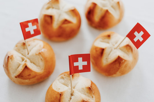 Traditional swiss bread buns called in German 1.Augustweggen baked in Switzerland to celebrate Swiss National Day on August 1st. The top of the bread being cut crosswise to shape a cross.