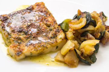 fried fish in the plate with vegetable