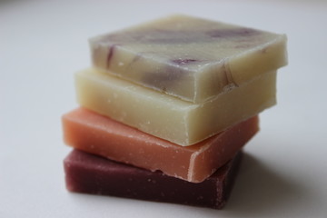 Natural handmade soap stacked piles close-up on a white background
