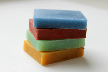 Natural handmade soap stacked piles close-up on a white background