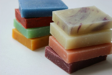 Natural handmade soap stacked piles close-up on a white background