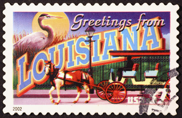 Greetings from Louisiana postcard on stamp