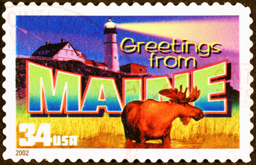 Greetings from Maine postcard on stamp