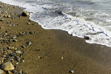 Sea surf on the beach. Wave