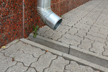 Galvanized steel drainage pipe and a concrete tray for rain water drainage