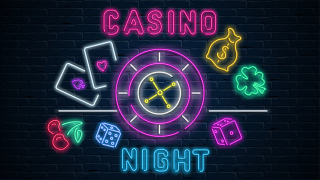 Colorful neon luminous casino night signboard on black bricklaying wall.